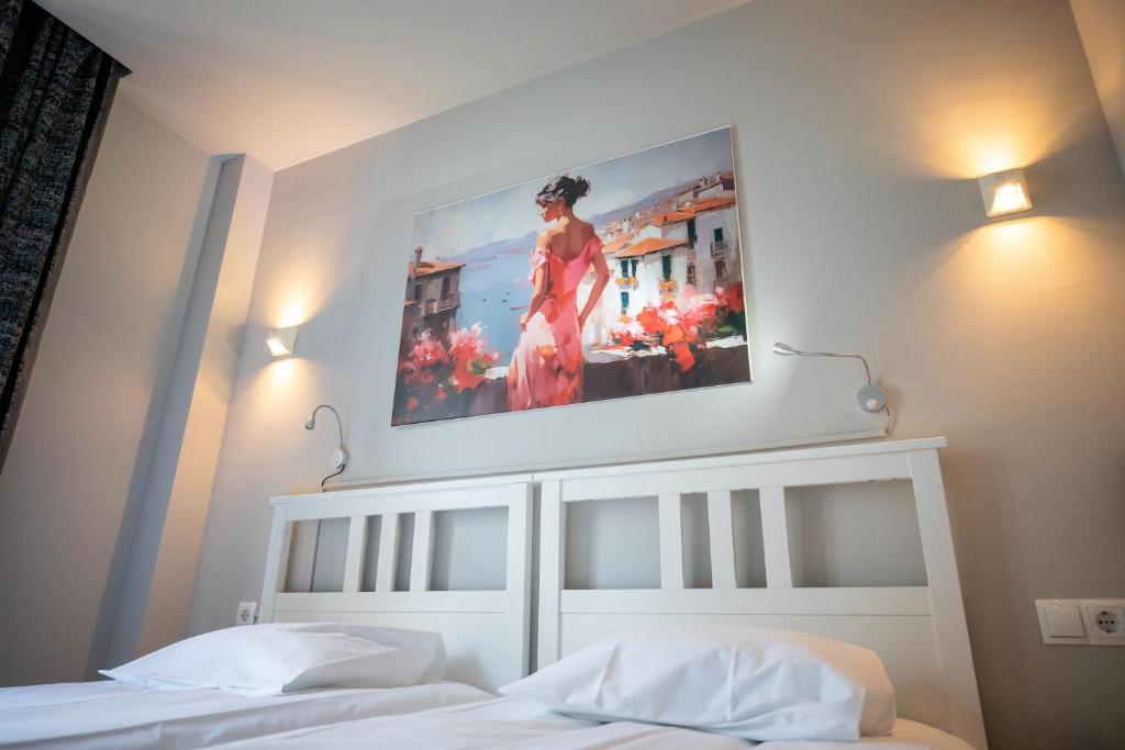 Postel nebo postele na pokoji v ubytování Hotel Bristol