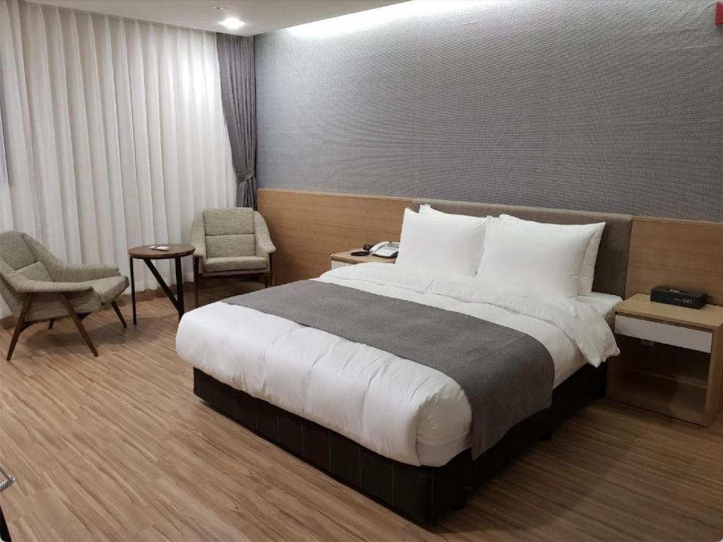 Postel nebo postele na pokoji v ubytování Hotel Ciel Dongtan