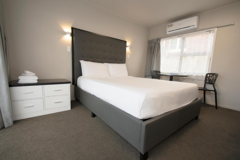 Postel nebo postele na pokoji v ubytování Middlemore Motel