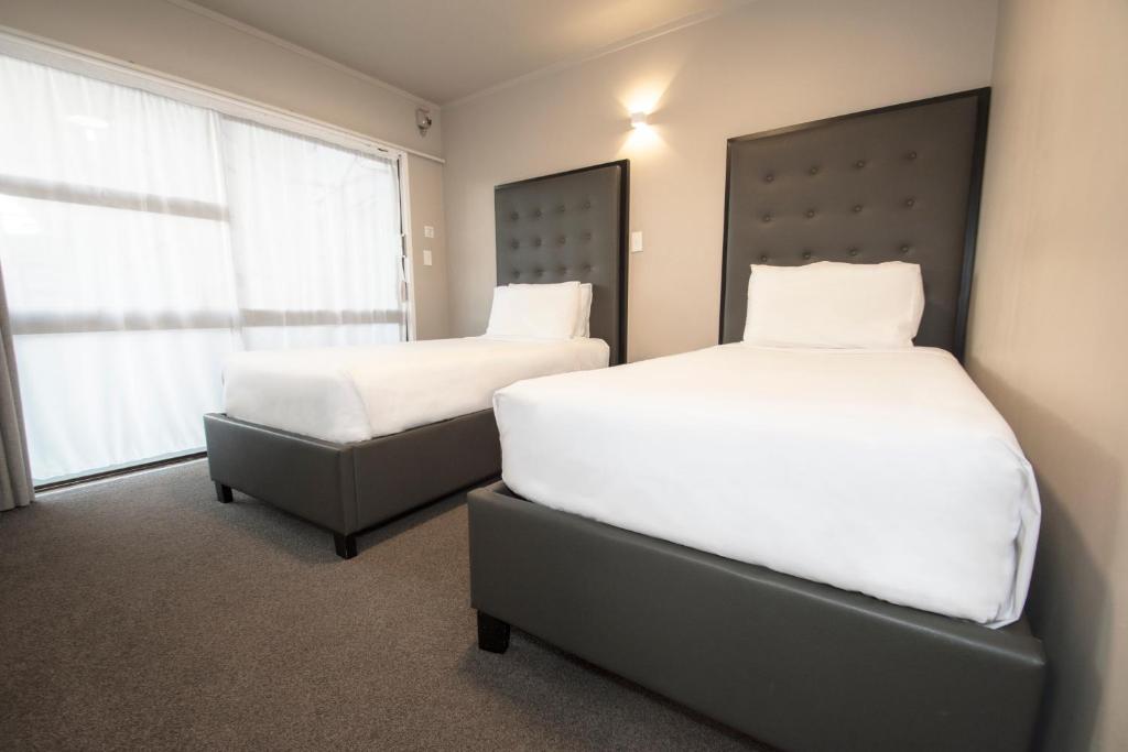Postel nebo postele na pokoji v ubytování Middlemore Motel