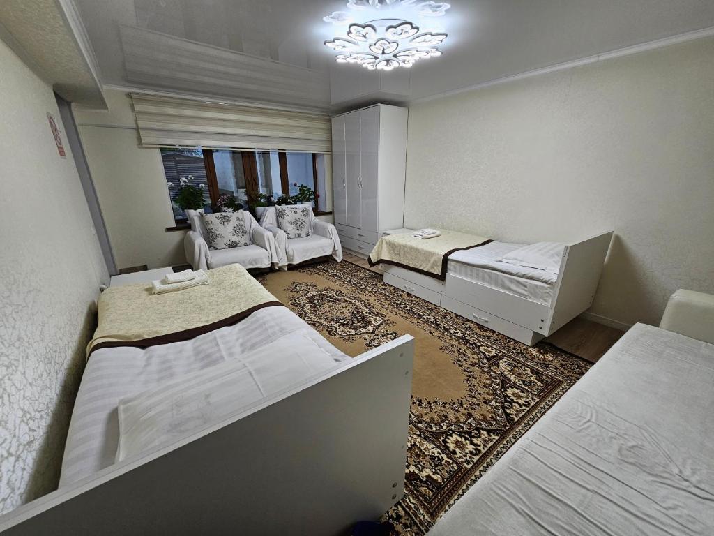 Postel nebo postele na pokoji v ubytování Guest House Tenir Too