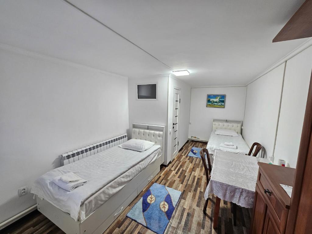 Postel nebo postele na pokoji v ubytování Guest House Tenir Too
