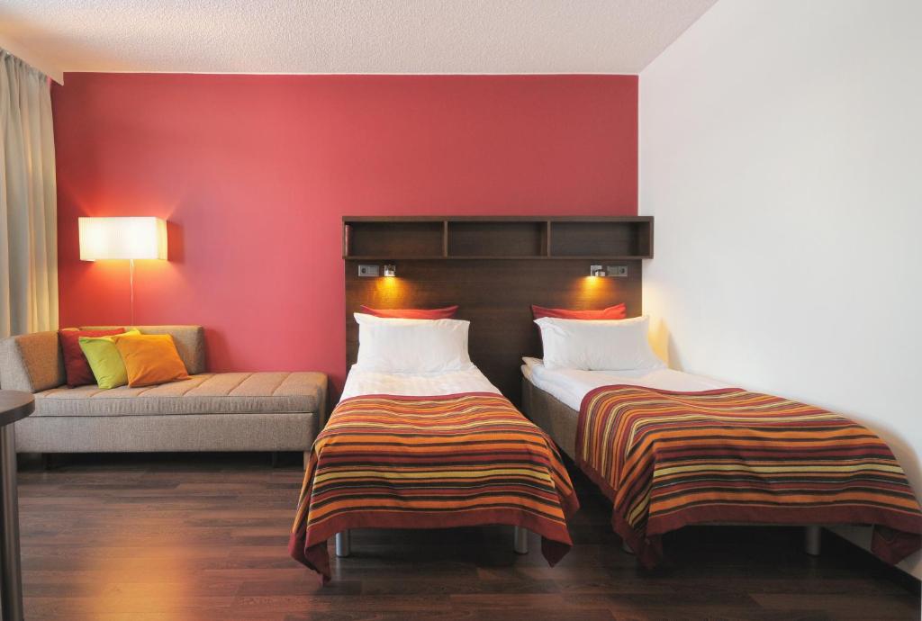 Postel nebo postele na pokoji v ubytování Sport & Spa Hotel Vesileppis