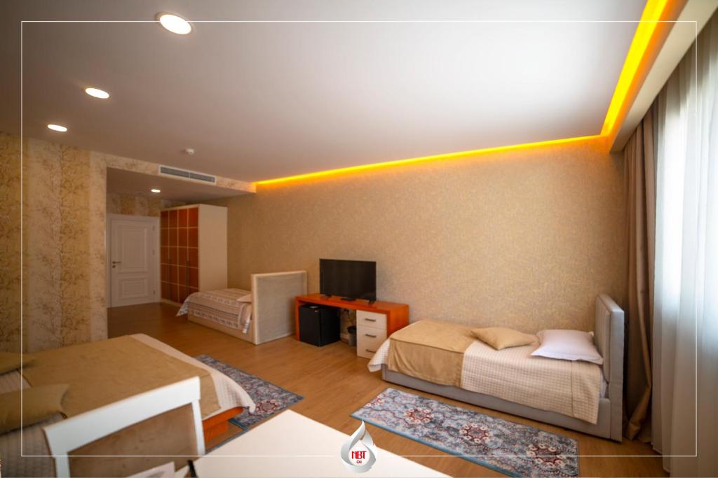 Postel nebo postele na pokoji v ubytování NBT Hotel Reps