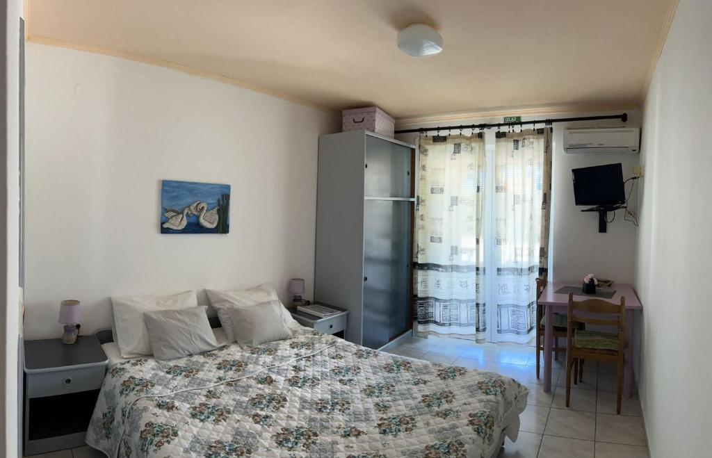 Postel nebo postele na pokoji v ubytování apartmani Natali