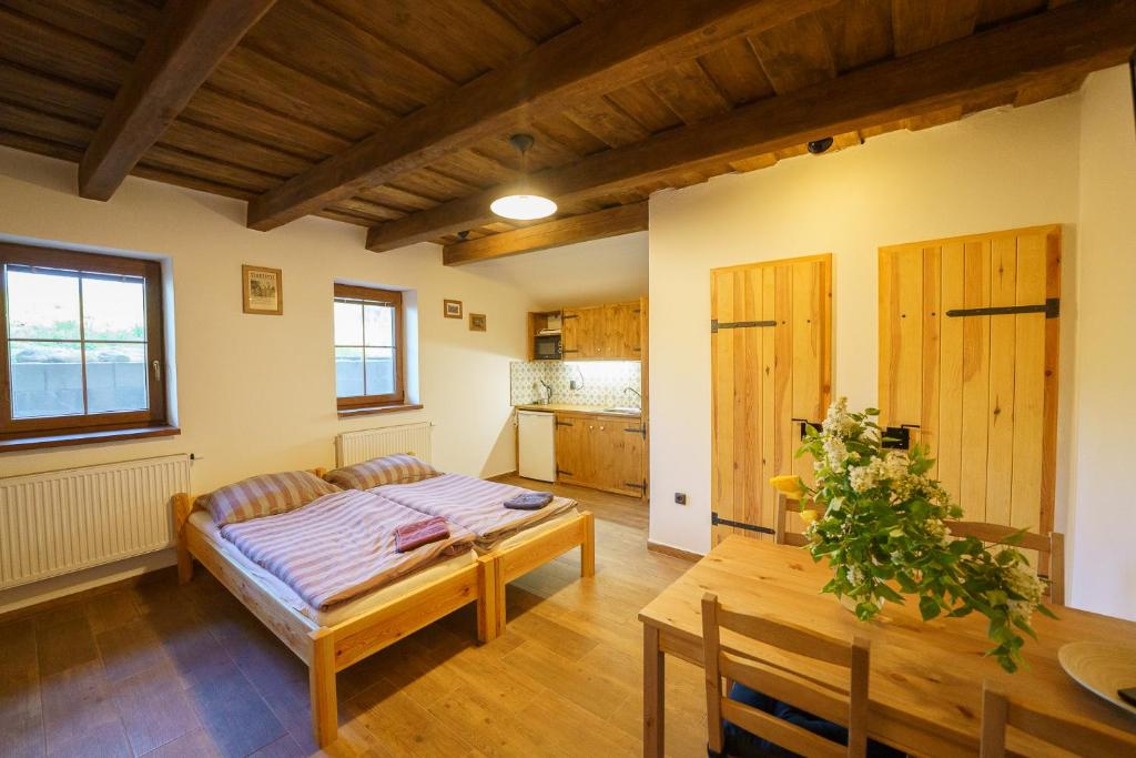 Postel nebo postele na pokoji v ubytování APARTMÁNY PAUSRAM