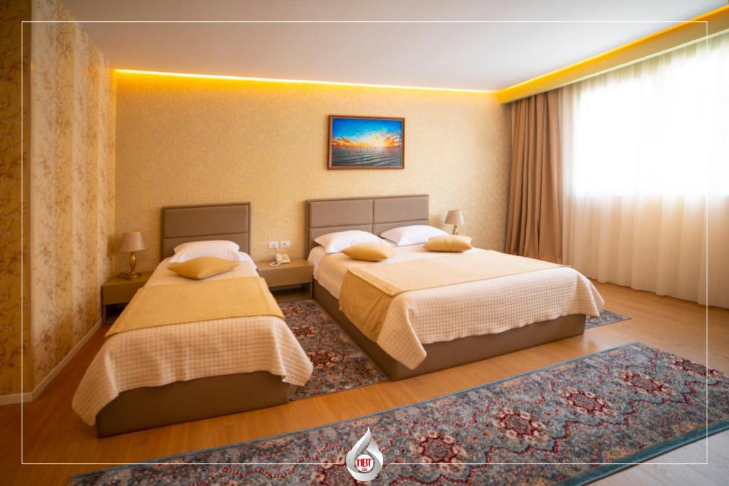 Postel nebo postele na pokoji v ubytování NBT Hotel Reps