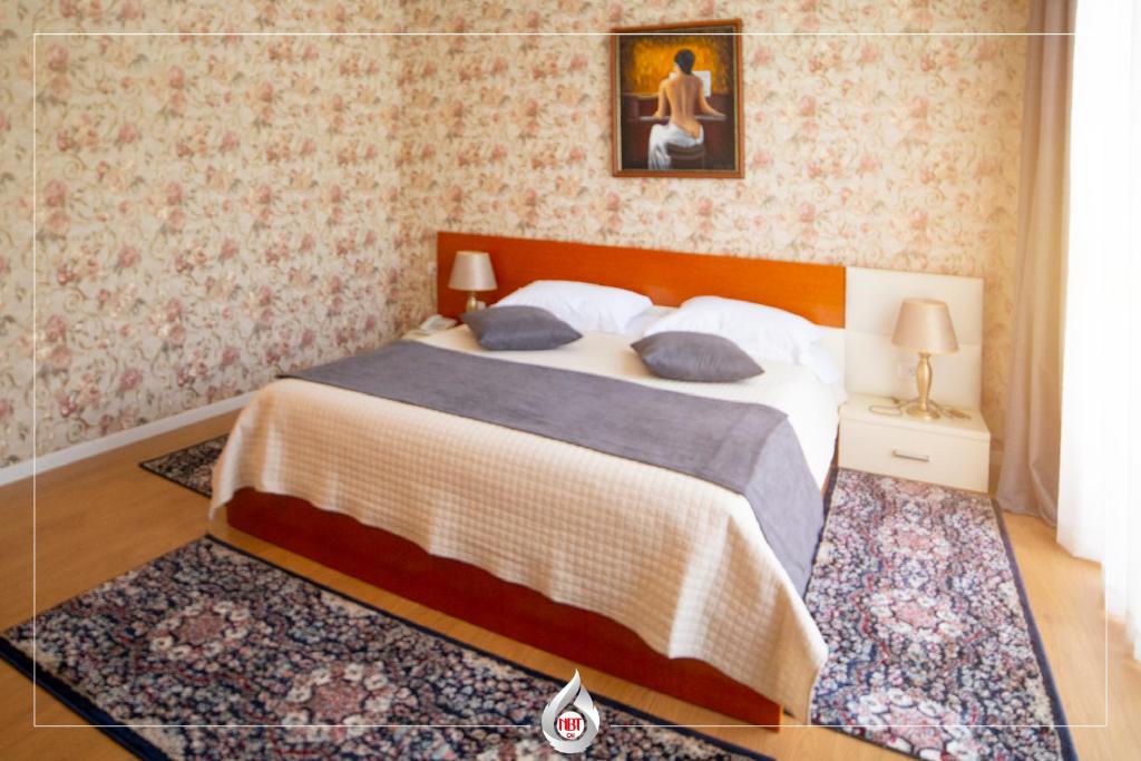 Postel nebo postele na pokoji v ubytování NBT Hotel Reps