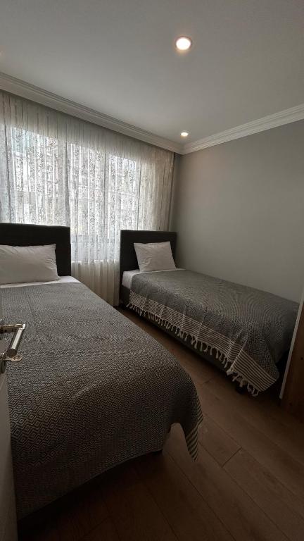 Postel nebo postele na pokoji v ubytování KELES HOME