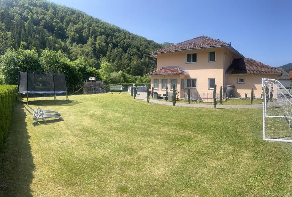 a large yard with a house and a goal at Toscana-Residenz im Schwarzwald in Utzenfeld