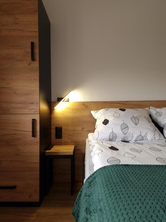 Ένα ή περισσότερα κρεβάτια σε δωμάτιο στο Bulwary Mszańskie - Pokoje