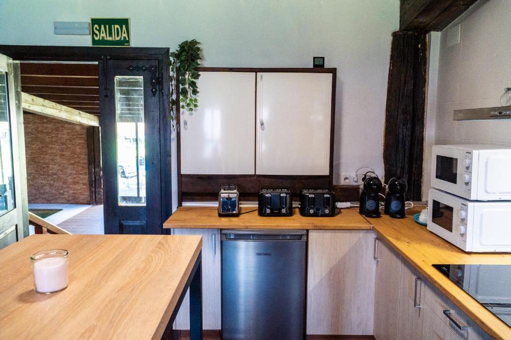 Kuchyň nebo kuchyňský kout v ubytování Albergue GBC Caldas