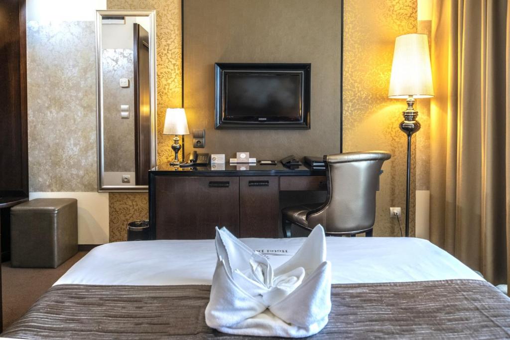 Postel nebo postele na pokoji v ubytování Hotel Délibáb