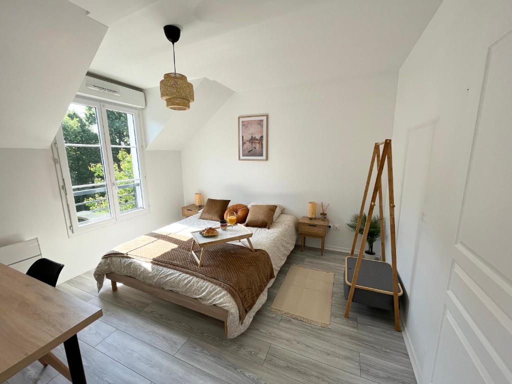Postel nebo postele na pokoji v ubytování COSY TORCY charmant 2 pièces entre Paris et Disney