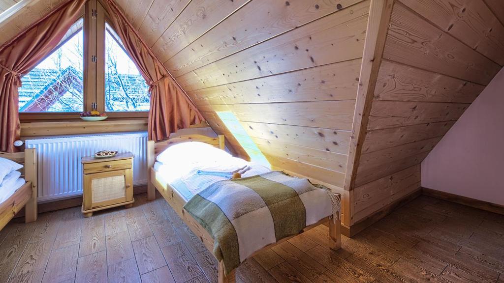 Posteľ alebo postele v izbe v ubytovaní VisitZakopane - City Apartments