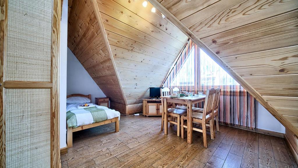 Posteľ alebo postele v izbe v ubytovaní VisitZakopane - City Apartments