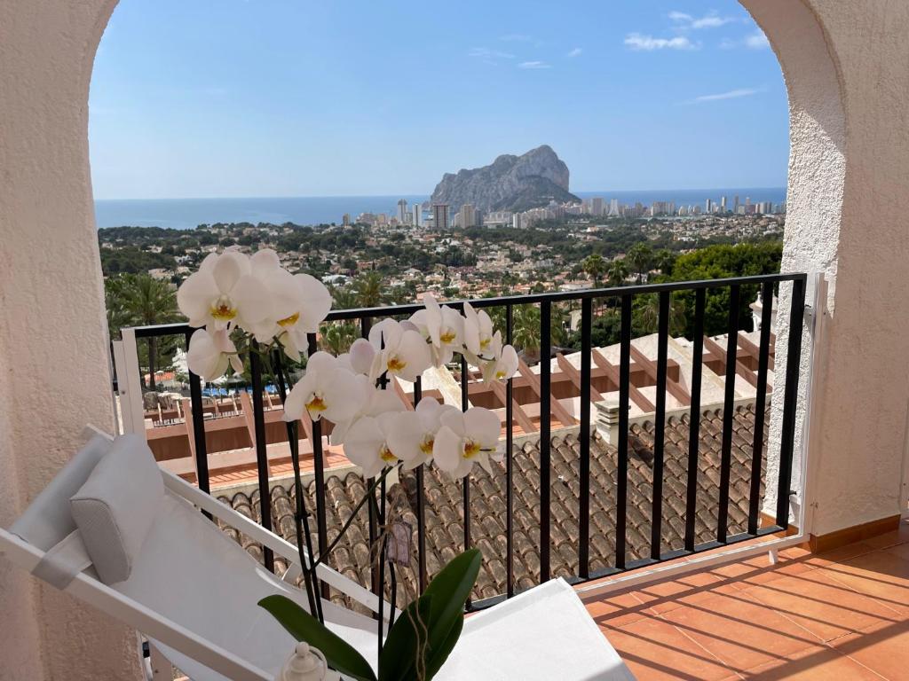a bunch of white flowers on a balcony at Pool paradise in Calpe