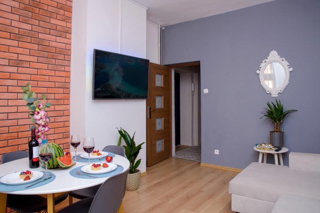 Televízia a/alebo spoločenská miestnosť v ubytovaní Maya's Flats & Resorts 19 & 20 - Ogarna