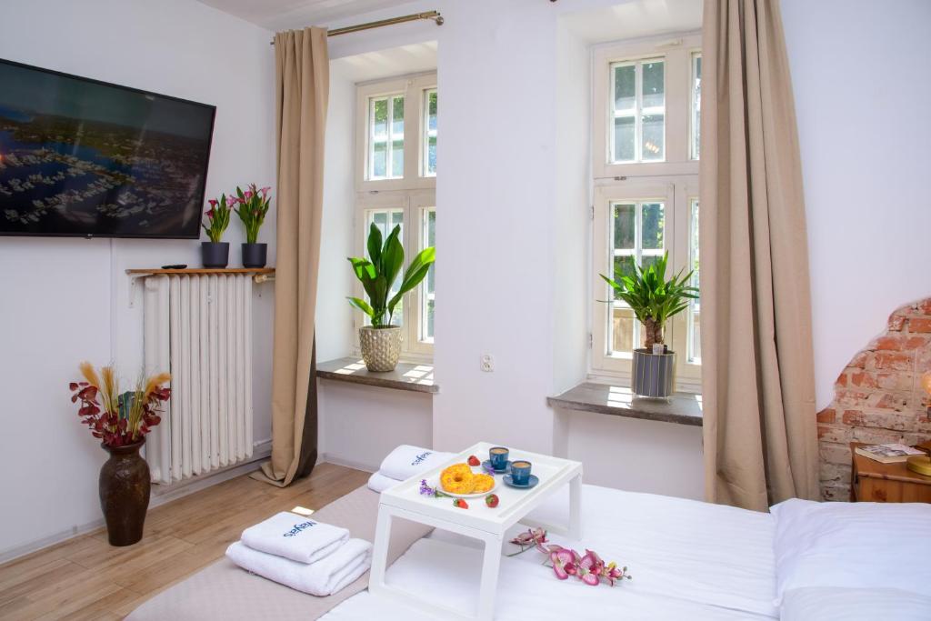 Televízia a/alebo spoločenská miestnosť v ubytovaní Maya's Flats & Resorts 19 & 20 - Ogarna