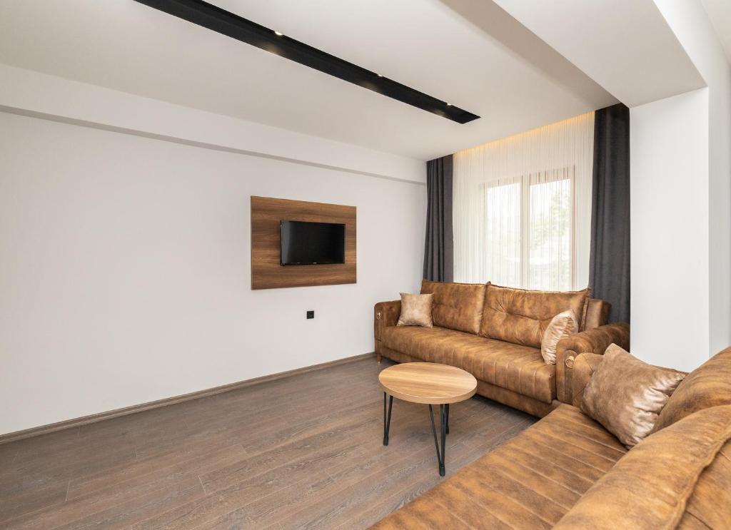 TV o dispositivi per l'intrattenimento presso Türkler Suite Hotel