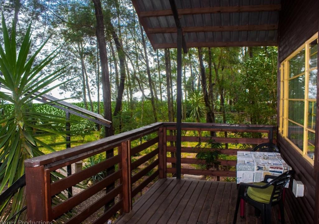 A balcony or terrace at Woodland Gardens Pet Friendly Lodge