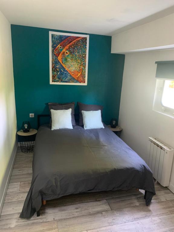 Posteľ alebo postele v izbe v ubytovaní chambres dans peniche un air de vacances