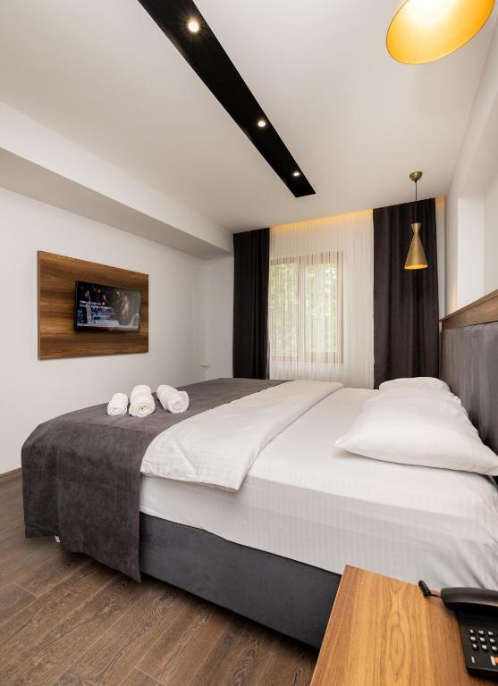 Letto o letti in una camera di Türkler Suite Hotel