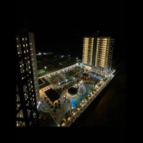 a view of a city at night with buildings at Salinas Exclusive Resort in Salinópolis