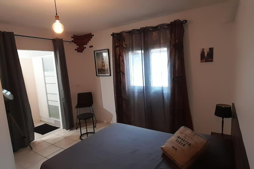 Postel nebo postele na pokoji v ubytování Maison cosy avec piscine