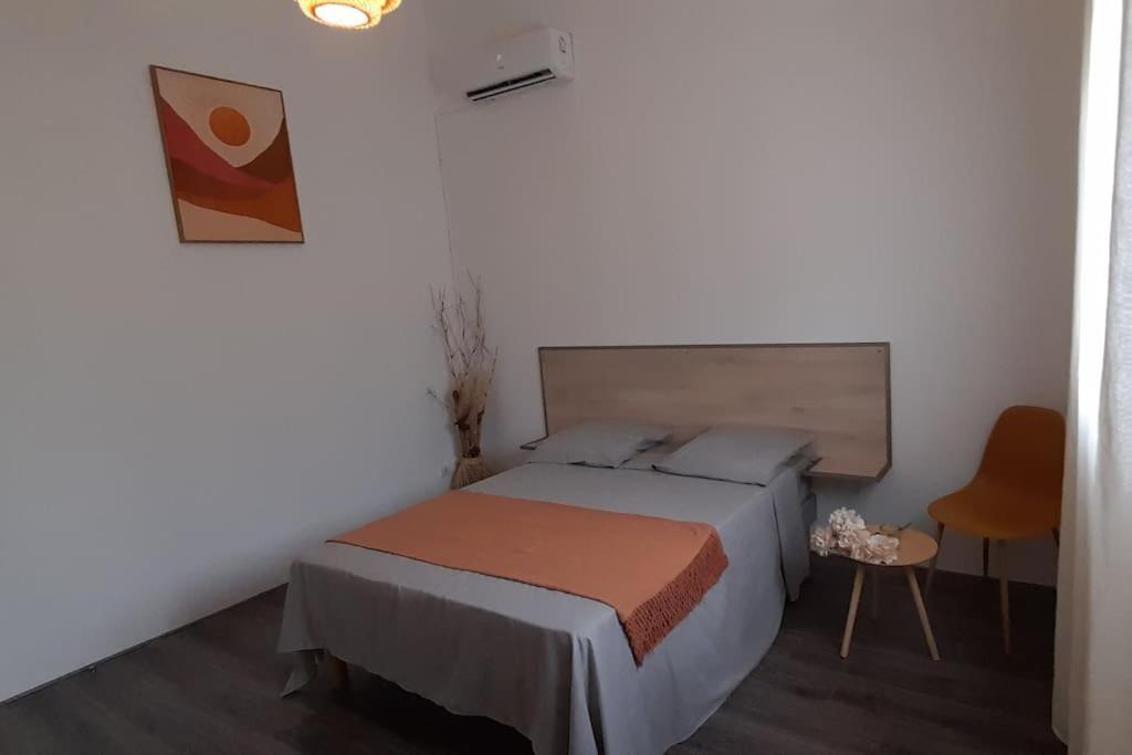 Postel nebo postele na pokoji v ubytování Maison cosy avec piscine