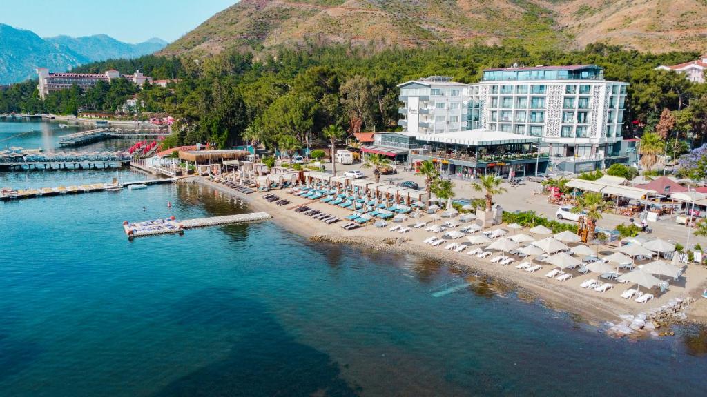 an aerial view of a beach with umbrellas and a resort at Class Unique Beach in Marmaris