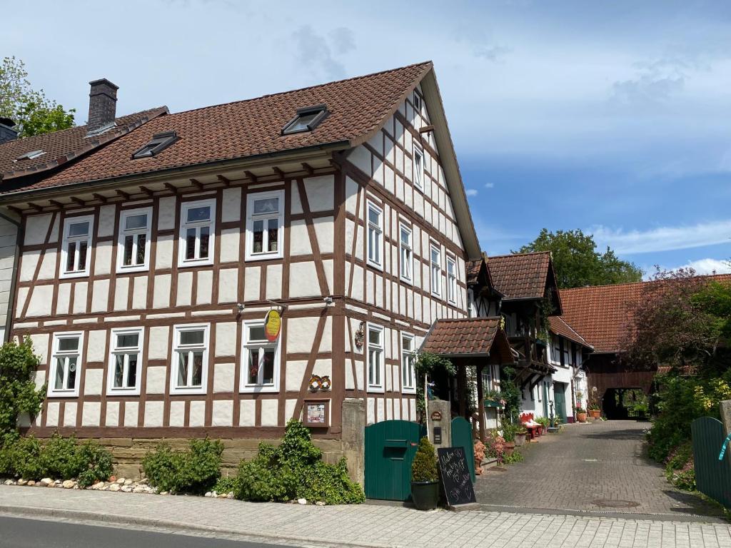 a half timbered building in a town with a street at Wohnen & Kunst in Bad Rodach