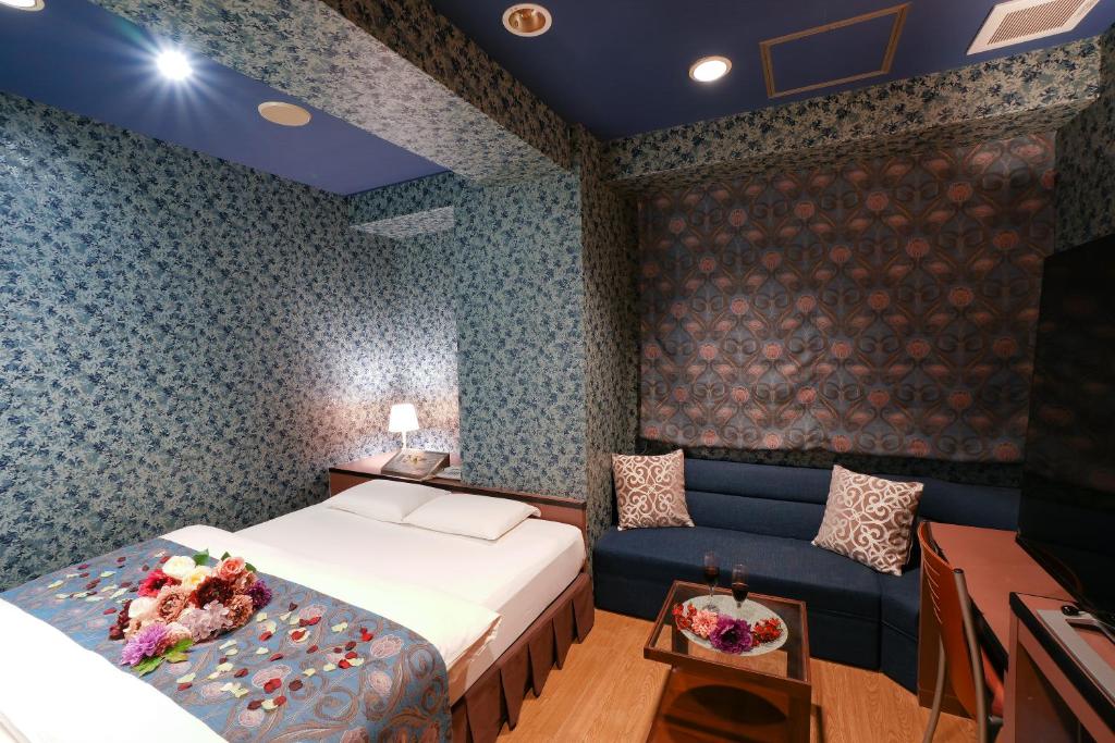 Postel nebo postele na pokoji v ubytování Hotel Jupiter (Adult Only)