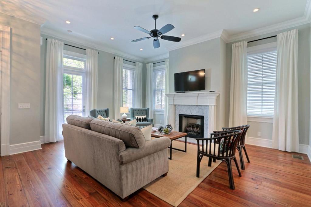 a living room with a couch and a fireplace at Congress Street Retreat in Savannah