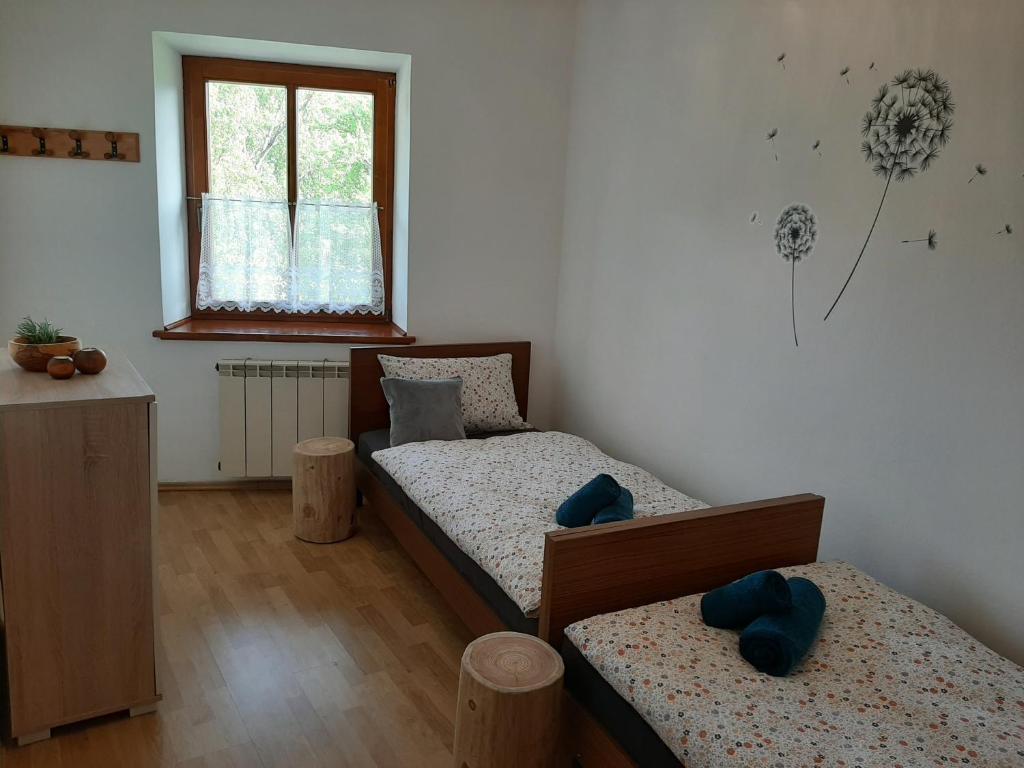 Postel nebo postele na pokoji v ubytování Holiday House Dori