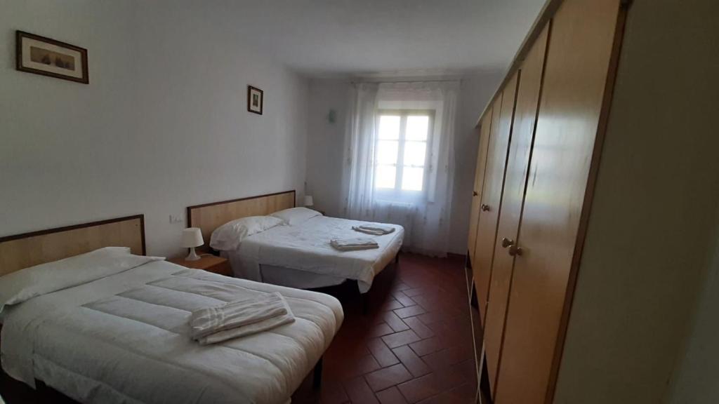 Postel nebo postele na pokoji v ubytování Residence San Francesco