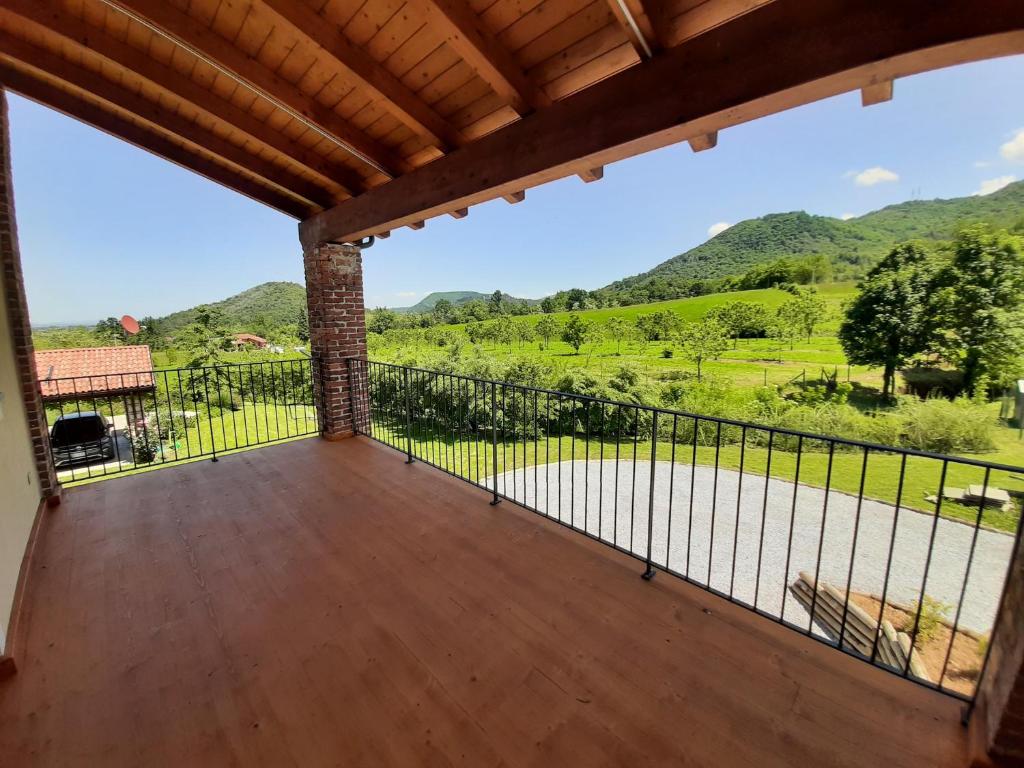 a balcony with a view of the mountains at CASA BRACCALDI in Peveragno