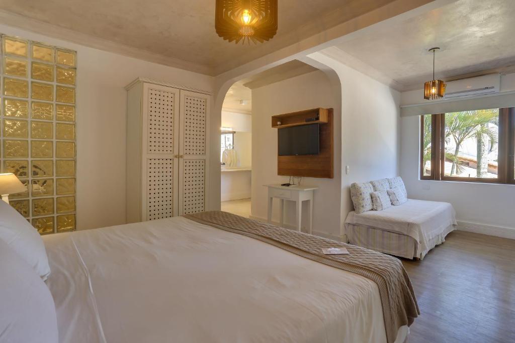 Cama ou camas em um quarto em Chez Louise et Louis Pé na Areia
