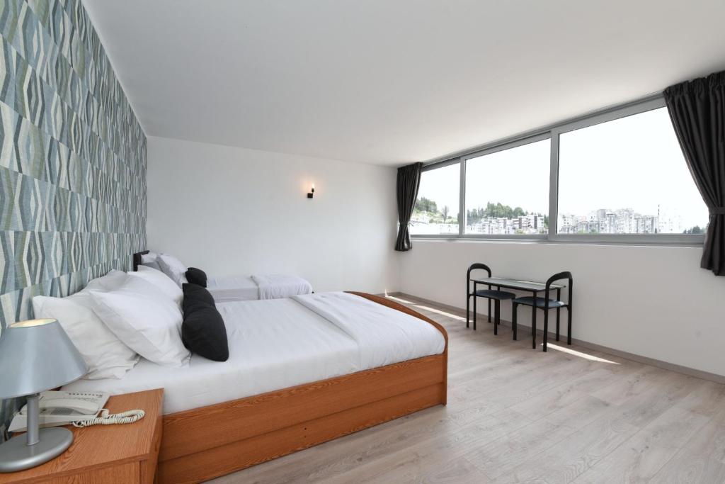 Postel nebo postele na pokoji v ubytování Hotel Tolero