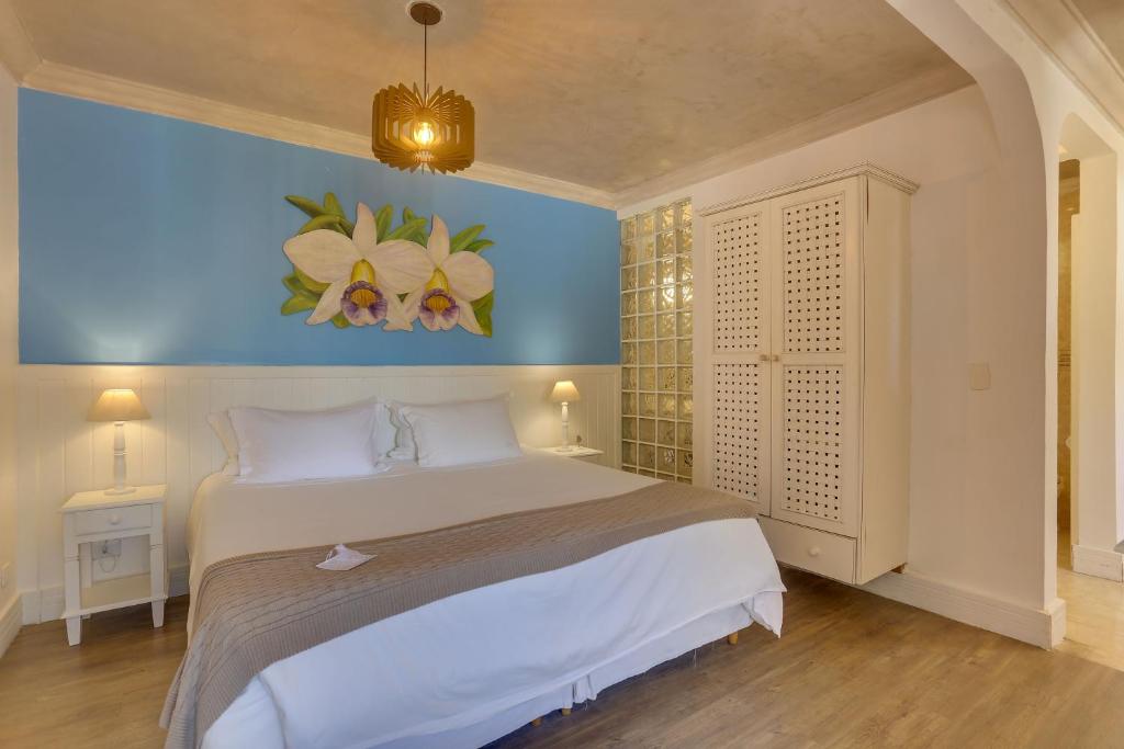 Cama ou camas em um quarto em Chez Louise et Louis Pé na Areia
