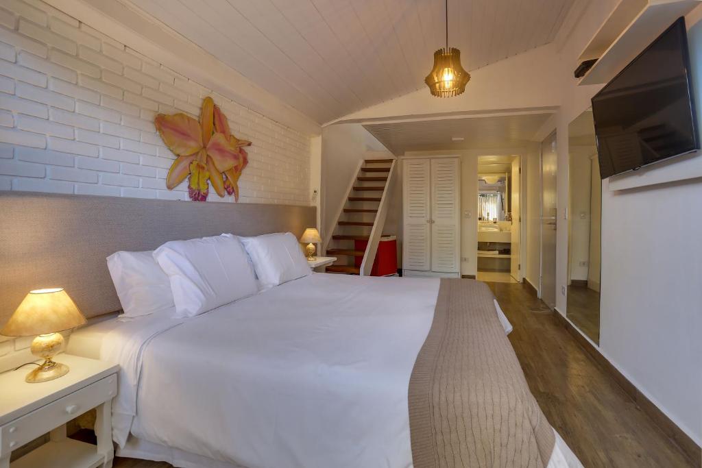 Cama ou camas em um quarto em Chez Louise et Louis Pé na Areia