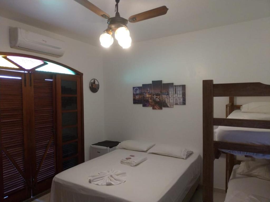Cama ou camas em um quarto em Hope Pousada
