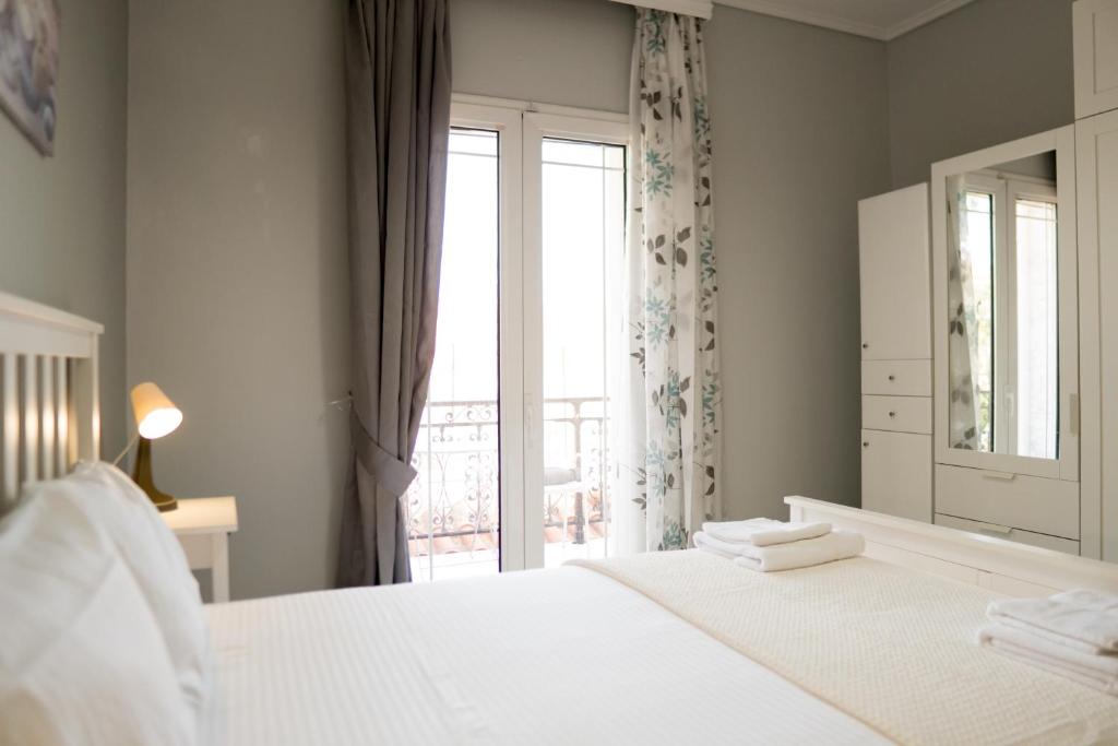 Postel nebo postele na pokoji v ubytování Raptis Guest House