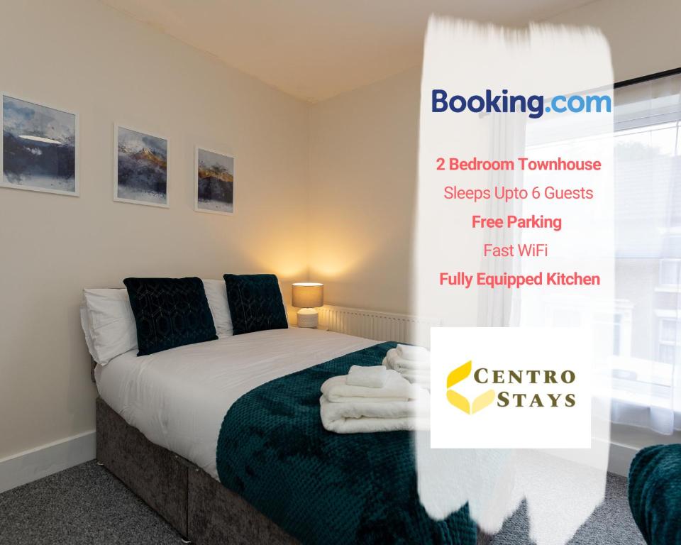 a bedroom with a bed and a sign that says centre stays at 5-10percent Off Week Monthly Stays Families, Groups, Contractor, Relocation or Corporate Booking in Northampton