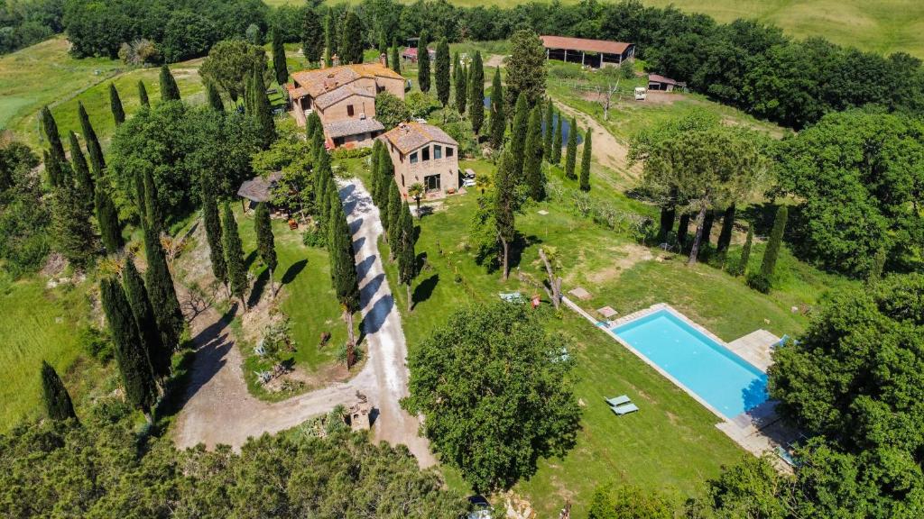 an aerial view of an estate with a train on the property at Agriturismo Quarantallina in Buonconvento