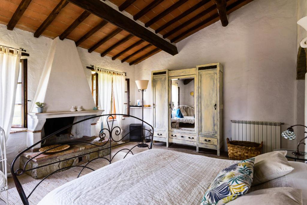 Postel nebo postele na pokoji v ubytování Agriturismo Quarantallina