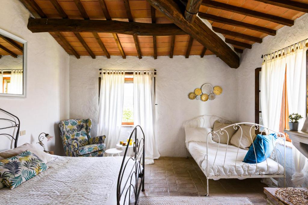 Postel nebo postele na pokoji v ubytování Agriturismo Quarantallina