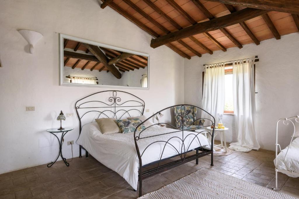 Postel nebo postele na pokoji v ubytování Agriturismo Quarantallina