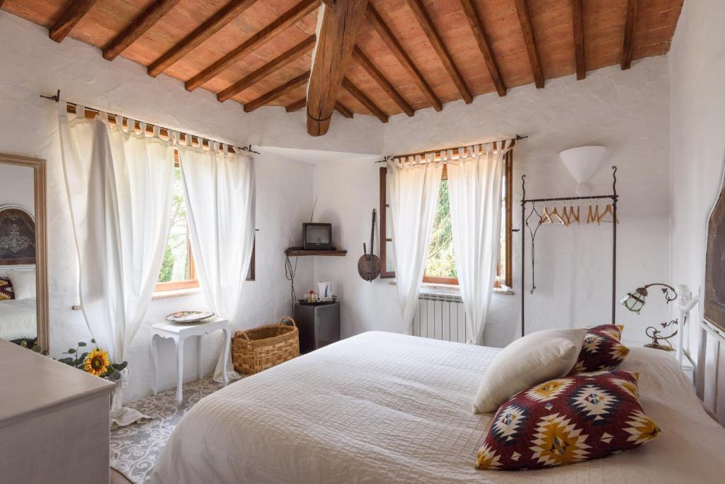 Postel nebo postele na pokoji v ubytování Agriturismo Quarantallina