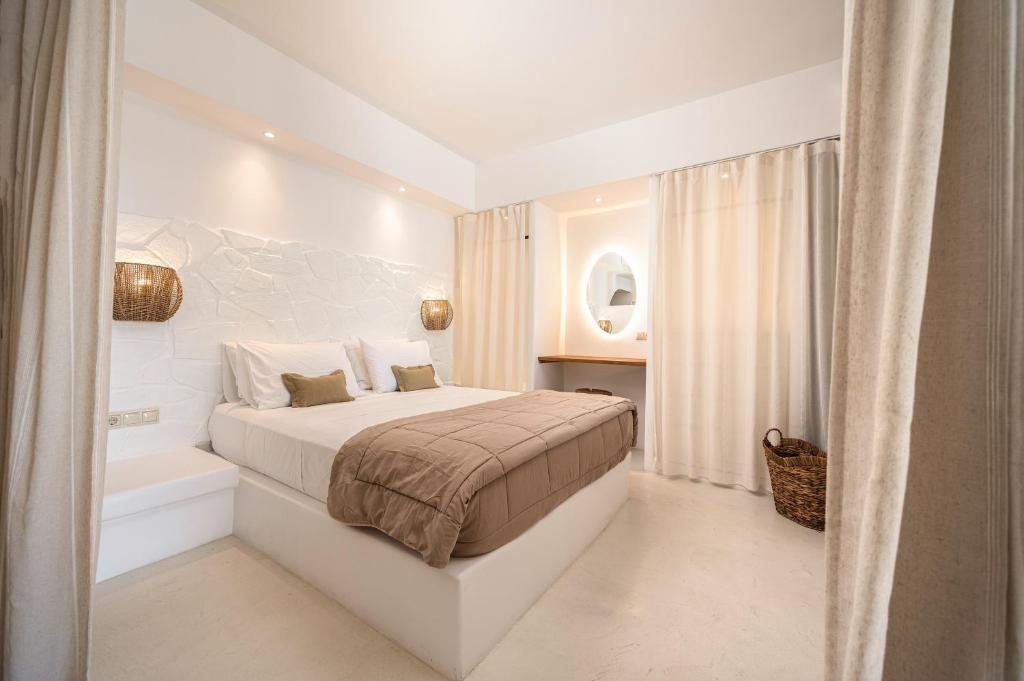 Postel nebo postele na pokoji v ubytování Euphoria Suites and Spa